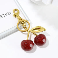 Bijou de Sac Pendentif Cerise Dore1