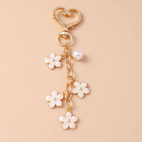 Bijou de Sac Pendentif Fleur Blanche