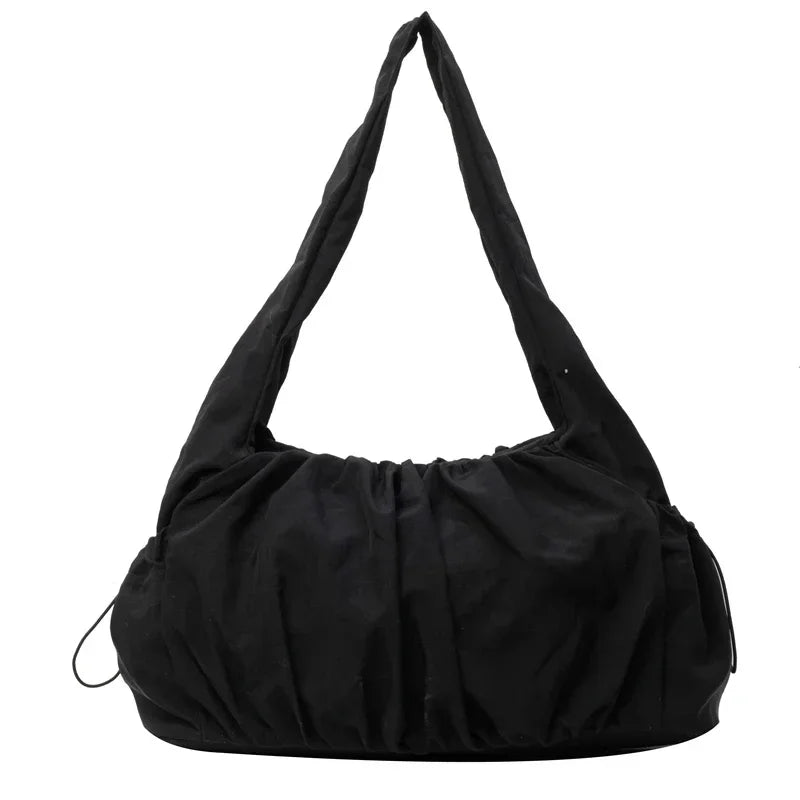 Sac cabas effet drape noir — vue de face sur fond blanc