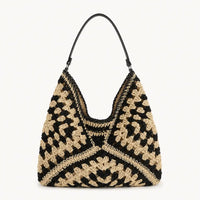 sac cabas paille ajouré noir sur fond blanc