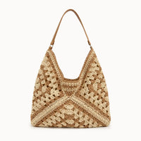 sac cabas paille ajouré sur fond blanc