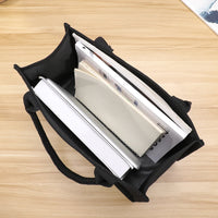 Sac cabas en toile noir — capacité intérieure vue du haut
